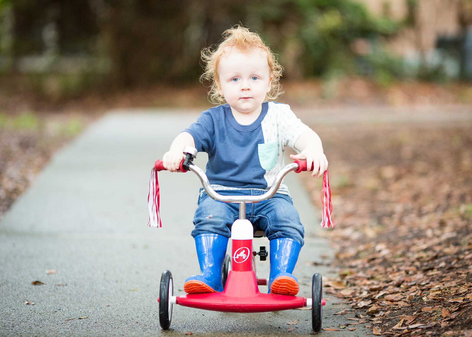 A boy rides a bike in the park