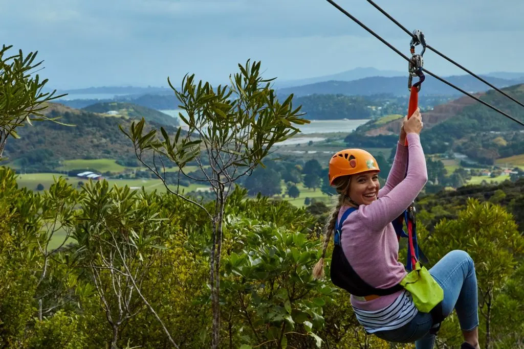 Girl zip lining on Waiheke Island.